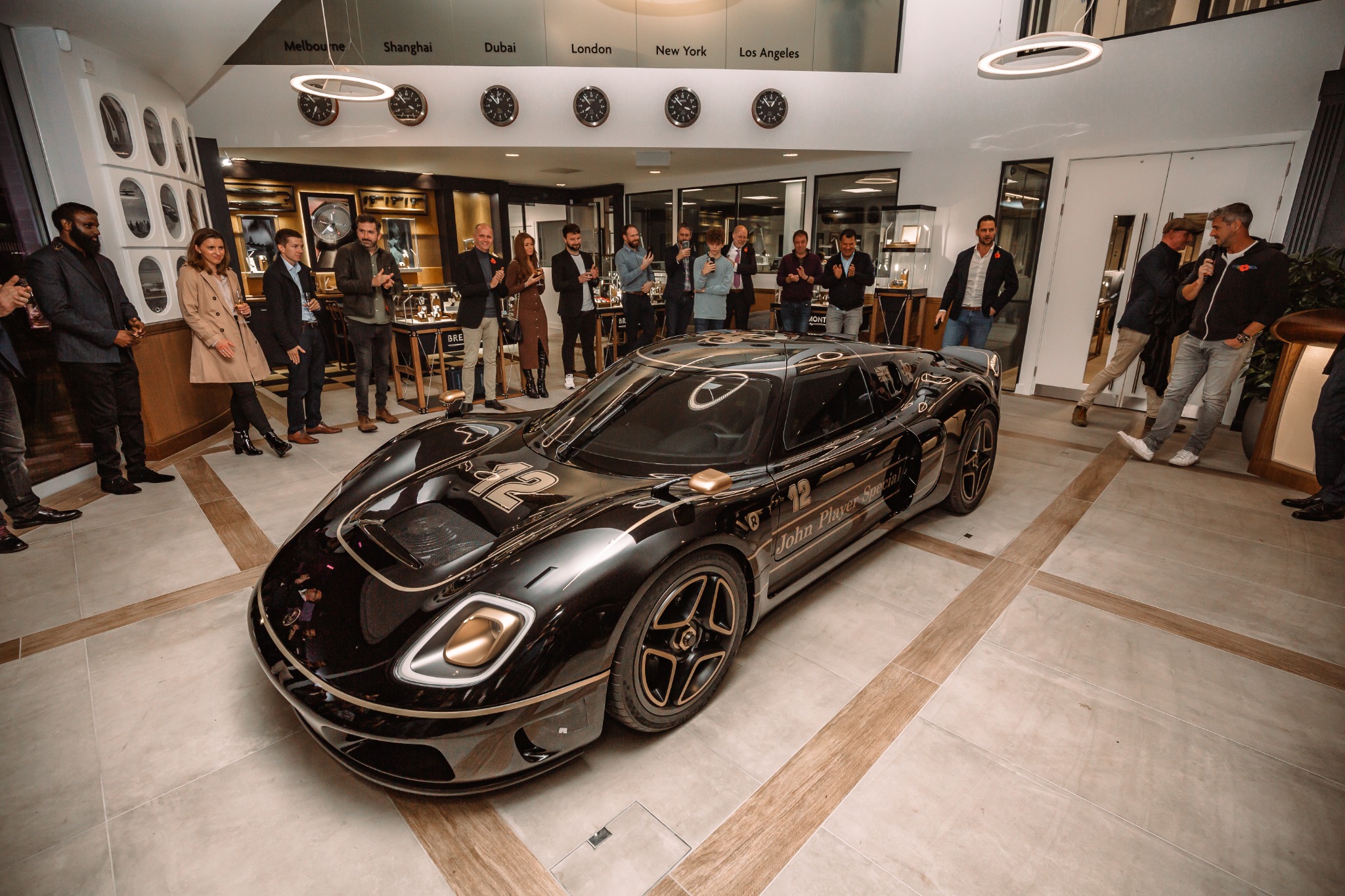 Guests at the unveiling of the black and gold Radford Type 62-2 John Player Special